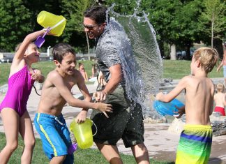 Dad water fight with kids